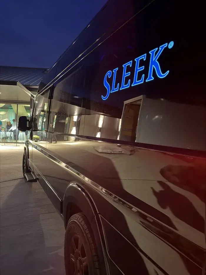 Sleek Transportation vehicle front view with illuminated branding