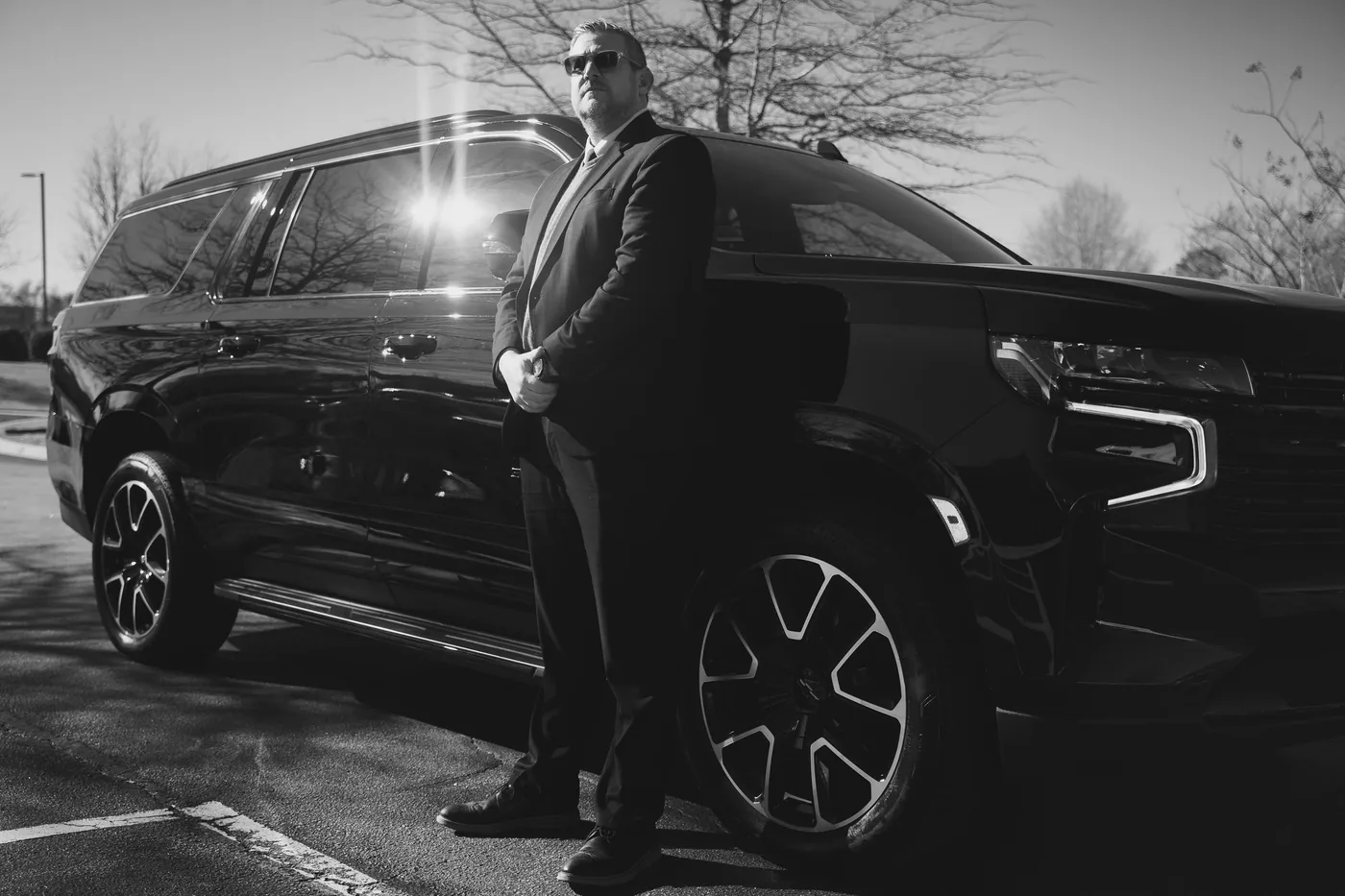 Sleek Transportation chauffeur with the fleet